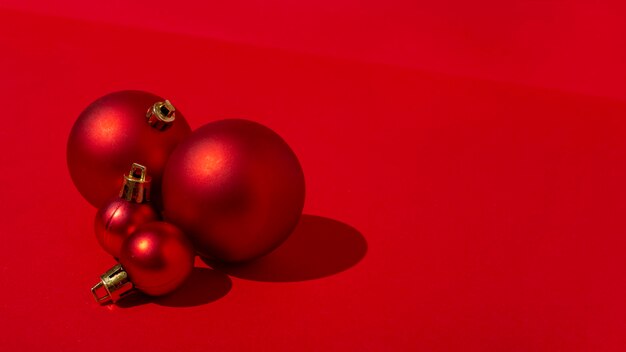 Red Christmas balls on red table