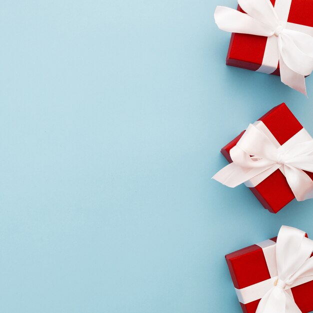 Red christmas gifts with white ribbon