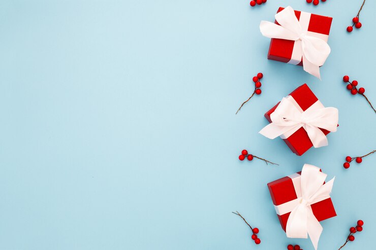Free Photo red christmas gifts with white ribbon