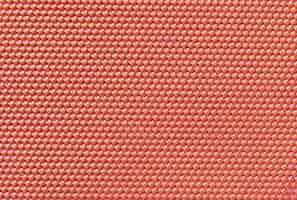 Free photo red colored honeycomb background