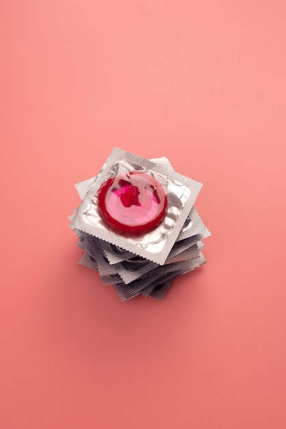 Red condoms arrangement high angle
