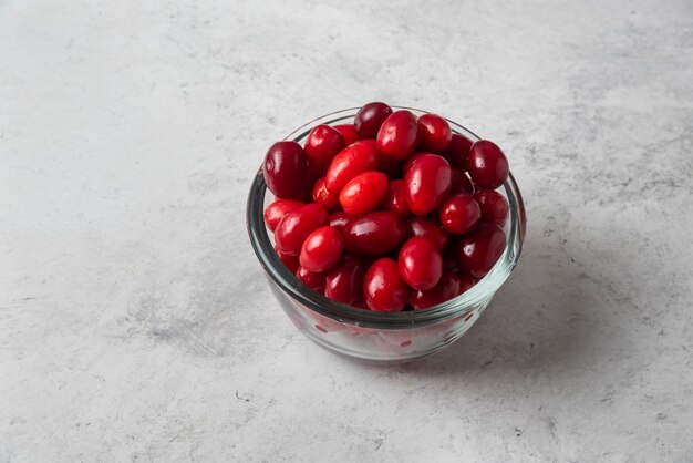 Red cornels in a glass cup. 