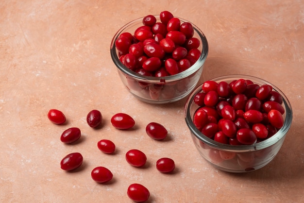 Free photo red cornels in glass cups.