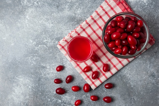 Free photo red cornels with in the glass, top view.