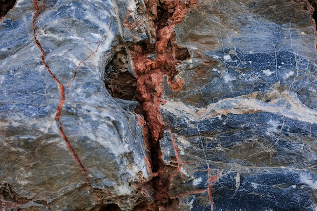 Red cracked on rock
