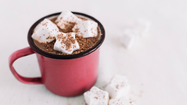 Red cup with cocoa and marshmallows 