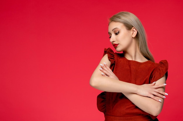 Red dress cute classy adorable girl in burgundy dress with red lipstick gently embracing herself