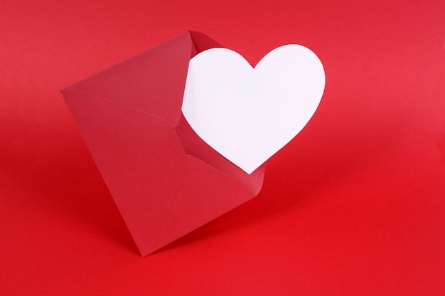 A red envelope with a white heart