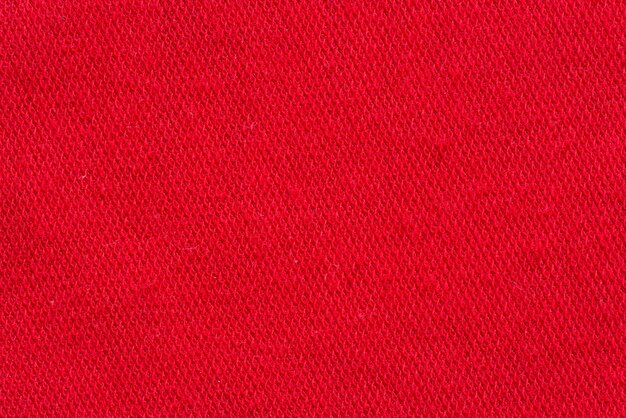 Red fabric canvas macro shot as texture or background