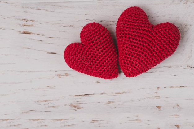 Red fabric hearts on a white background