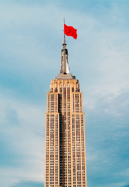 Red flag collage on top of building