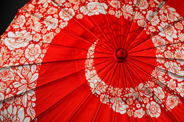 Red floral wagasa umbrella in studio top view