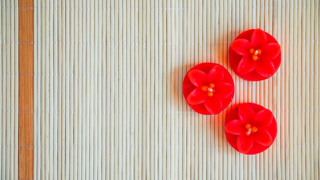 Red flower-shaped candles