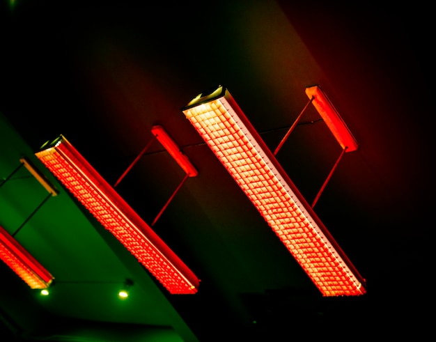 Free photo red fluorescent lamp hanging from the ceiling