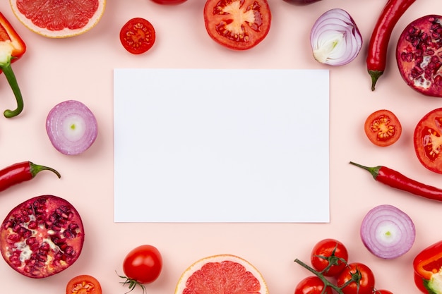 Red fruits and vegetables arrangement flat lay