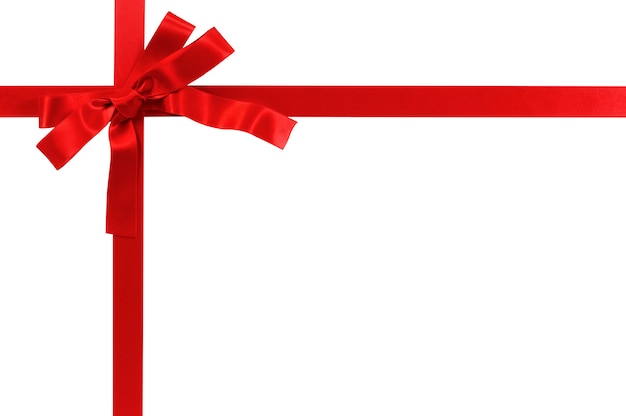 赤い贈り物の弓とリボンは、白い背景に