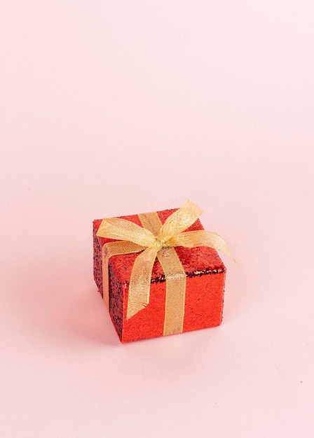 Red gift box with golden ribbon