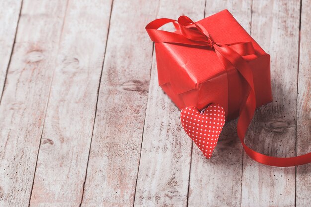 Red gift pack with a heart supported