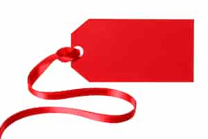 Free photo red gift tag or price ticket with curly red ribbon