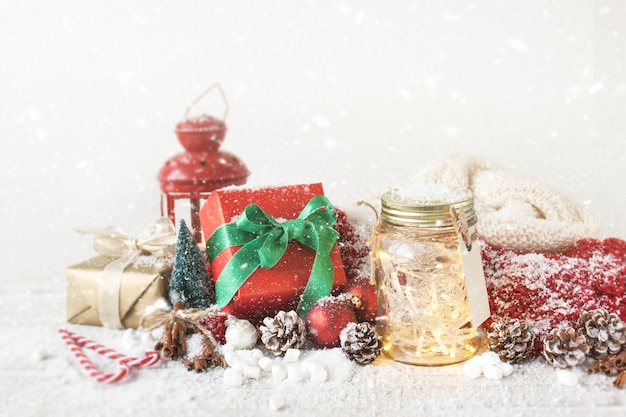 Red gift with a glass jar with lights