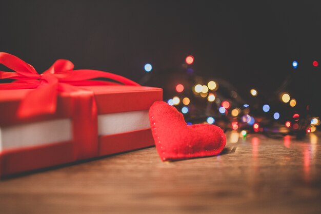 Red gift with a heart and lights