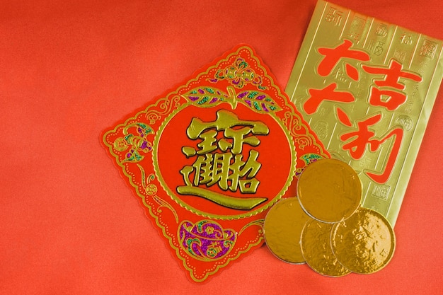 Red and gold card with some coins