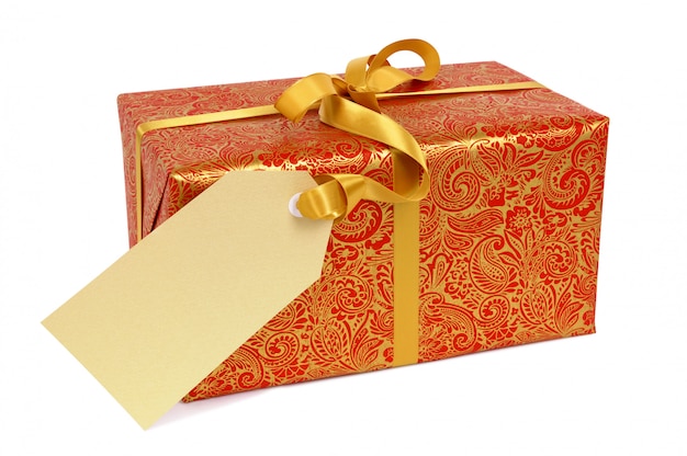 Red and gold gift with ribbon and tag.