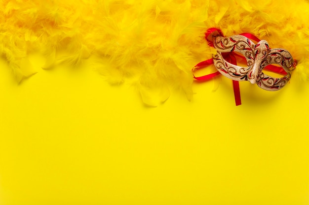 Red and golden carnival mask with copy space