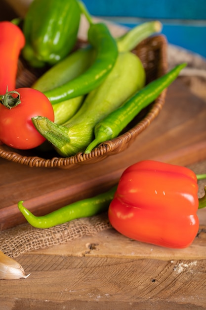 Red and green chili peppers on a wooden board