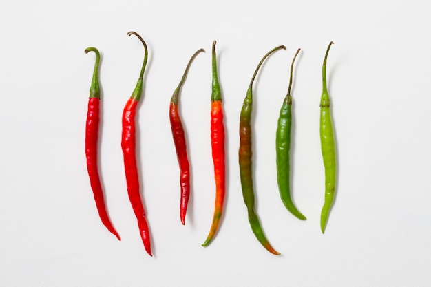 Red and green peppers arranged vertically