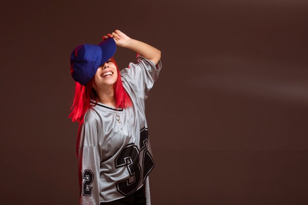 Red hair girl in sport outfits looks fun.