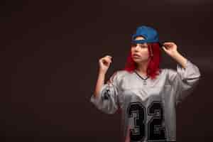 Free photo red hair girl in sport outfits.