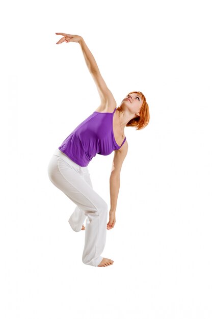 Red haired girl performing fitness exercises