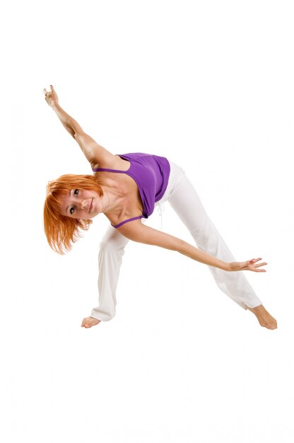 Red haired girl performing fitness exercises