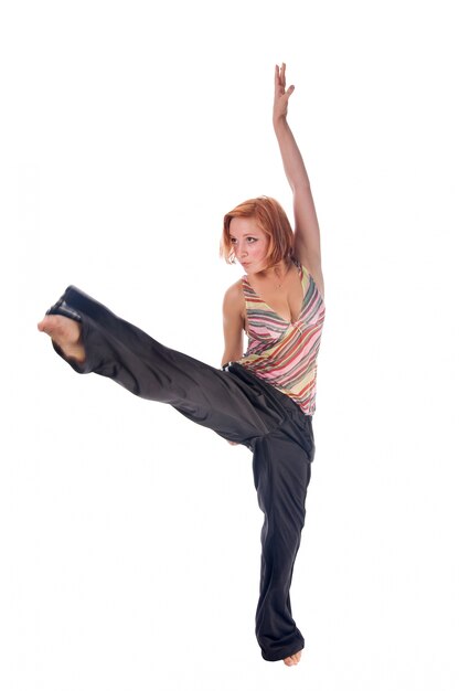 Free photo red haired girl performing fitness exercises