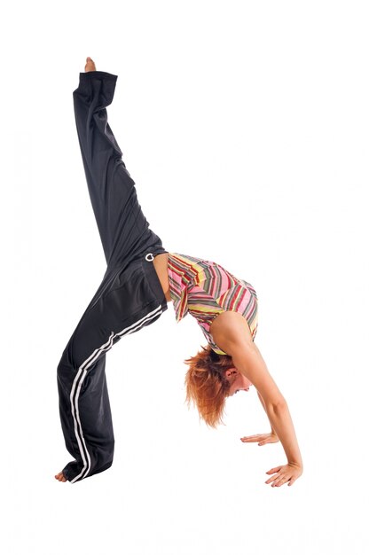 Red haired girl performing fitness exercises