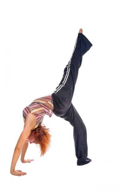 Red haired girl performing fitness exercises