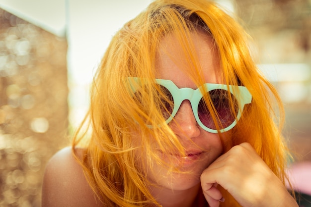 Red haired woman in beach cafe