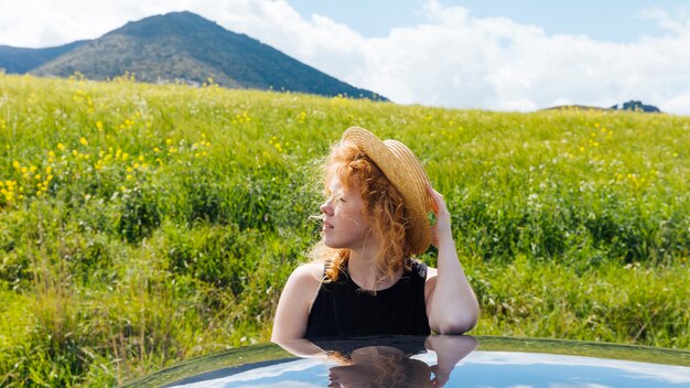 Red-haired woman in nature