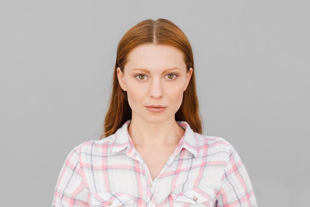 Red haired woman in studio