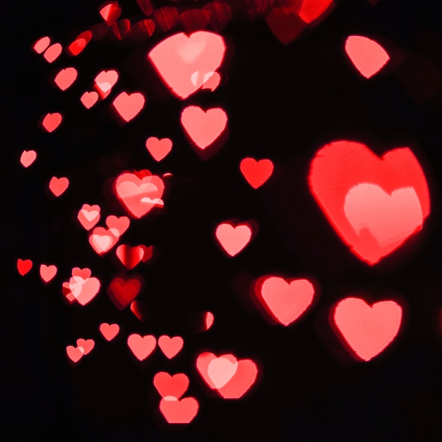 Red hearts on black