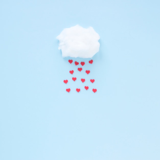 Free photo red hearts falling from cloud