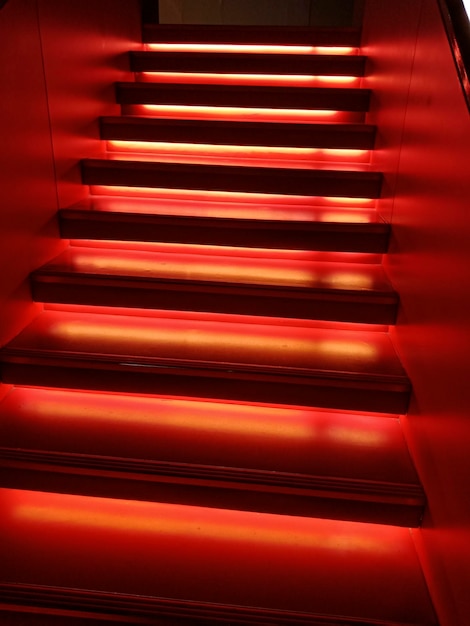 Red illuminated stairs indoors