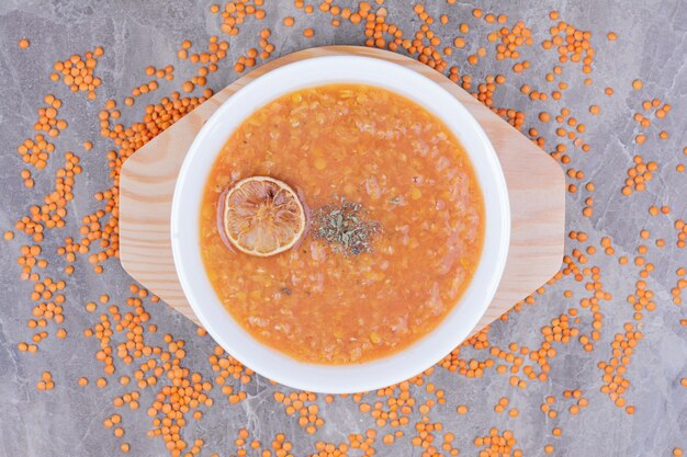 Red lentil soup with a slice of lemonnd spices.