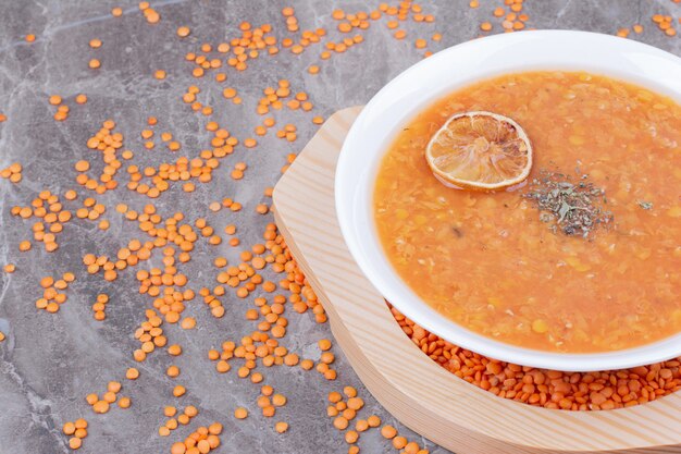 Red lentil soup with a slice of lemonnd spices.