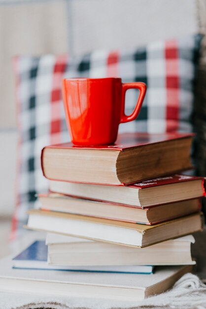 Red mug on books