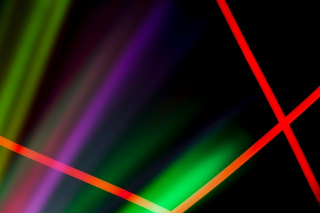 Red neon lines over the colorful laser light on dark background