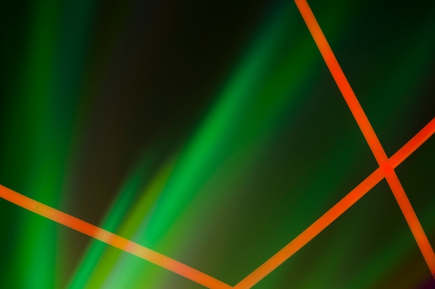 Red neon lines on green illuminated dark background