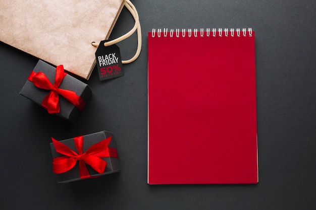 Red notebook mock-up with presents