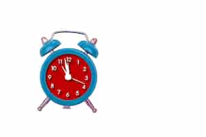 Free photo red old style alarm clock isolated on white.